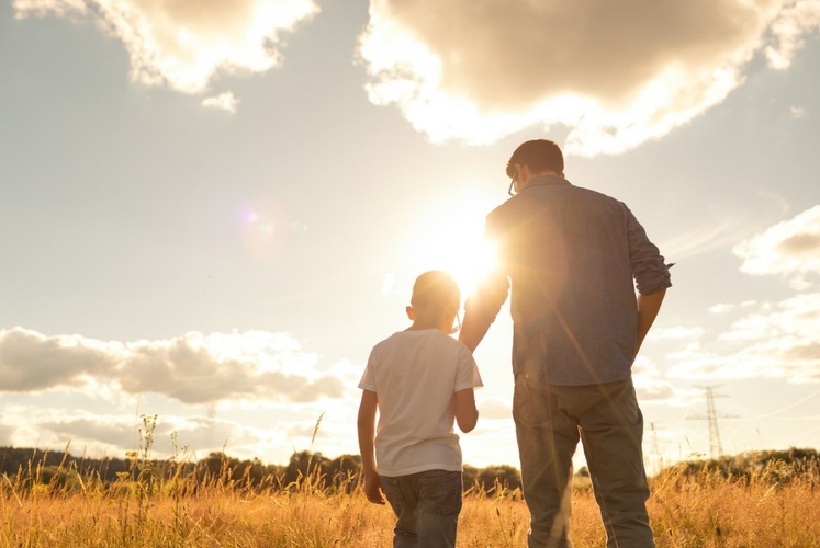Parent and child walking together representing generational trauma and family patterns across generations