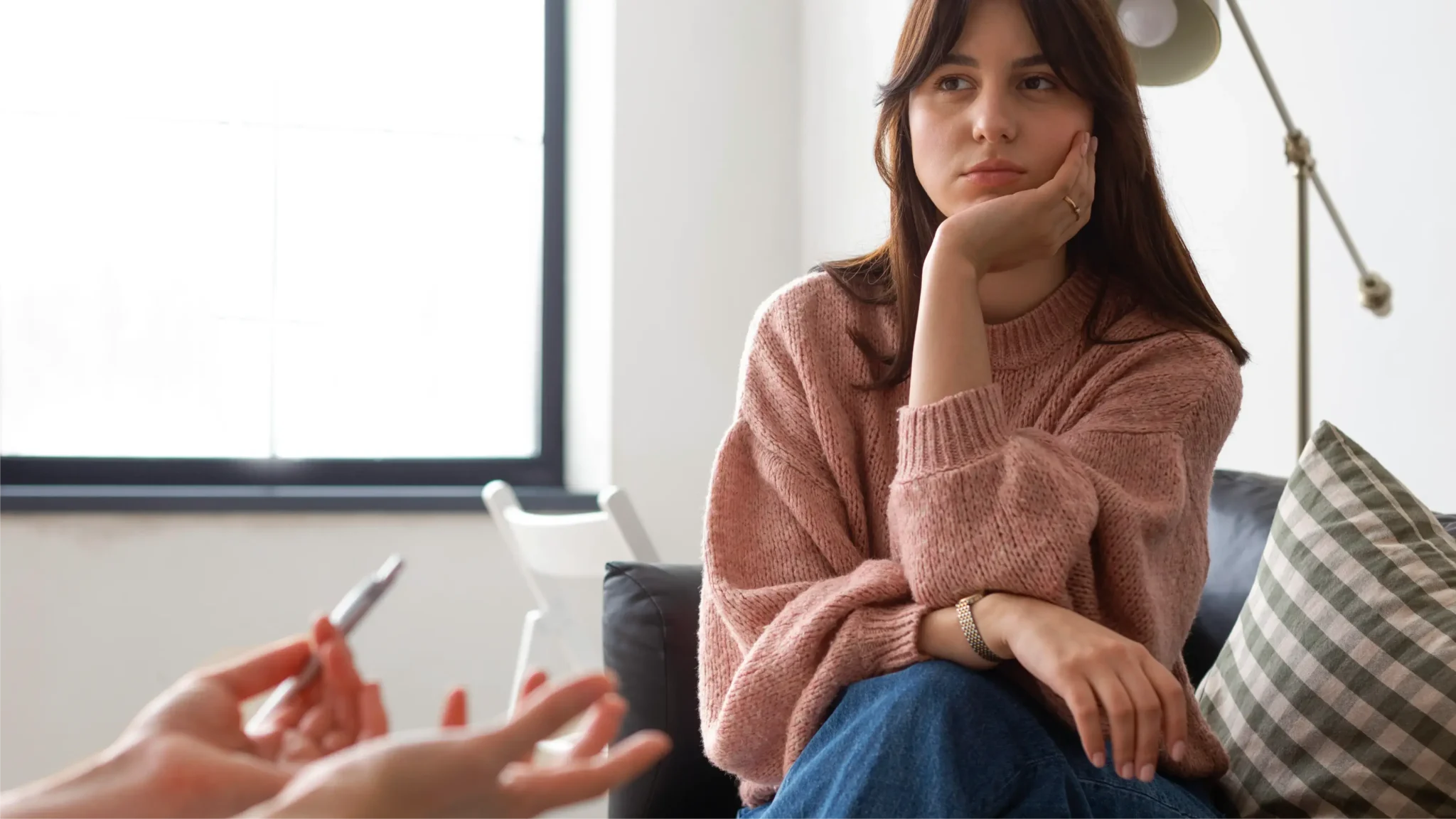 Woman speaking with a prospective therapist during a counseling consultation