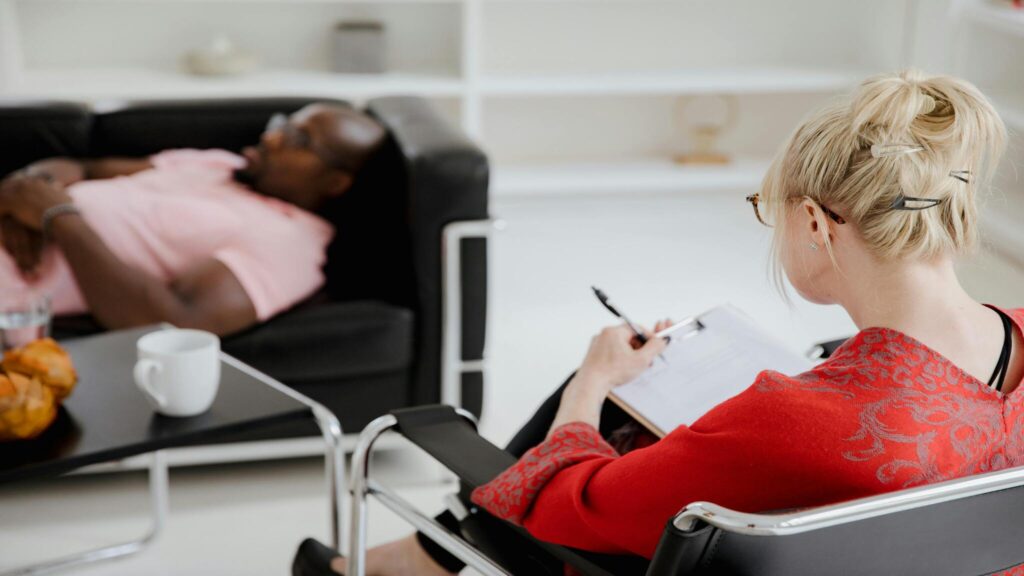 Client and therapist during an individual trauma therapy session focused on gradual trauma processing