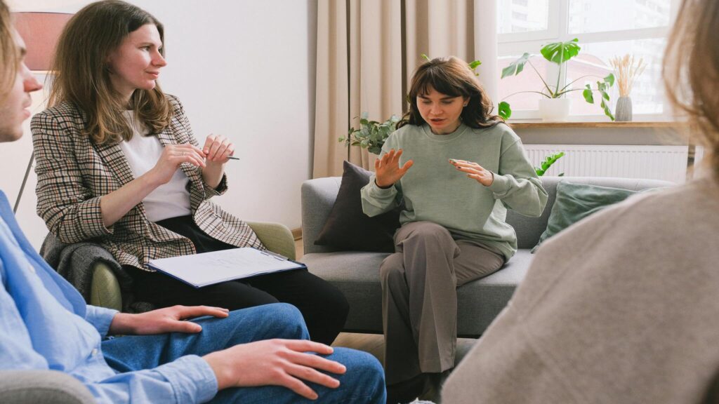 Therapist leading a counseling session representing factors that affect EMDR therapy cost in Denver