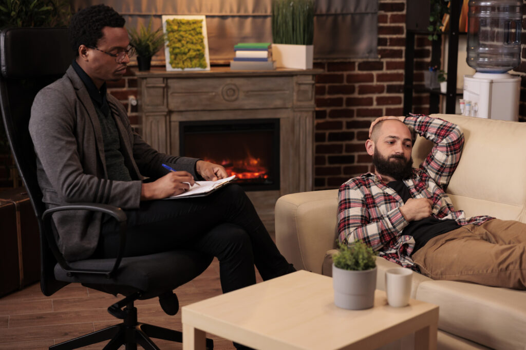 Client discussing anxiety with a therapist during a counseling session