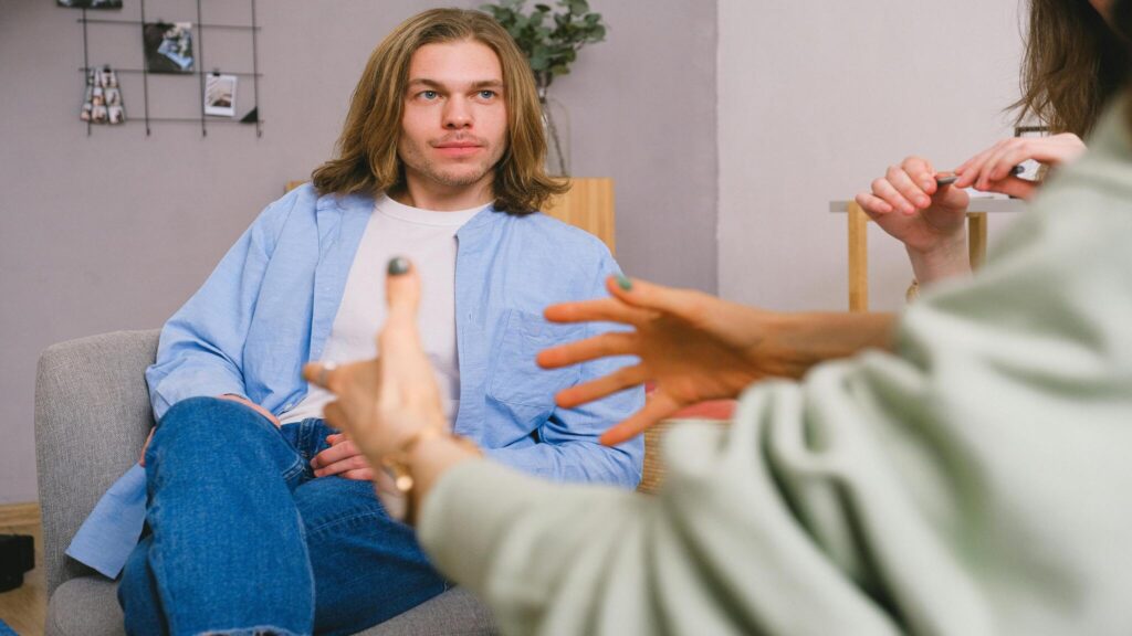 Client speaking with a therapist during an individual trauma therapy session