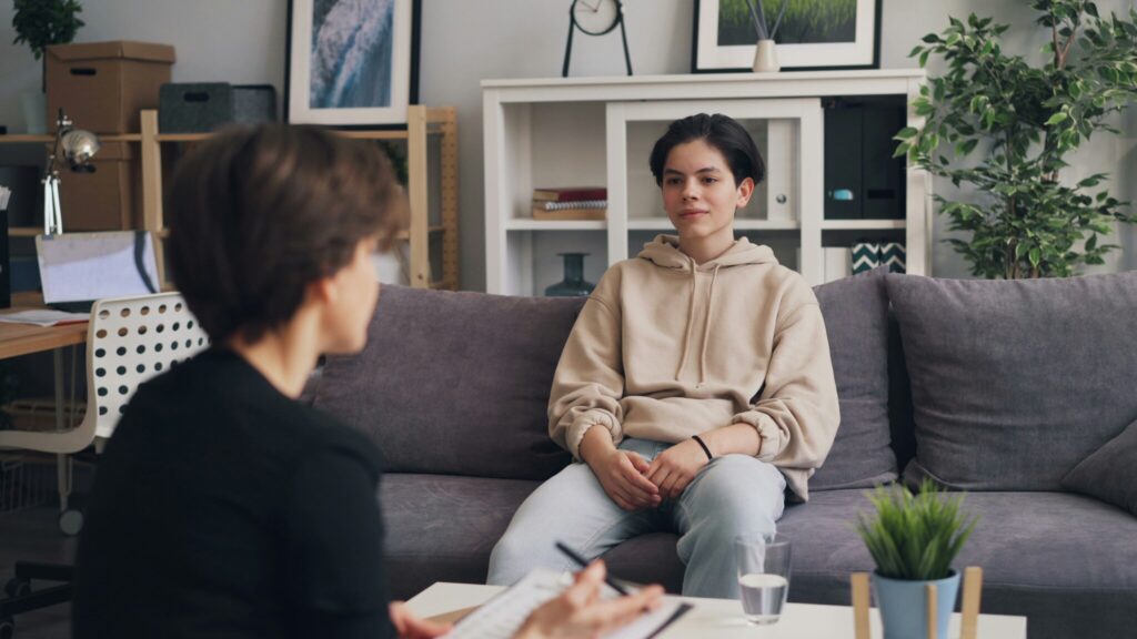 Client sitting with a therapist during a one-on-one counseling session