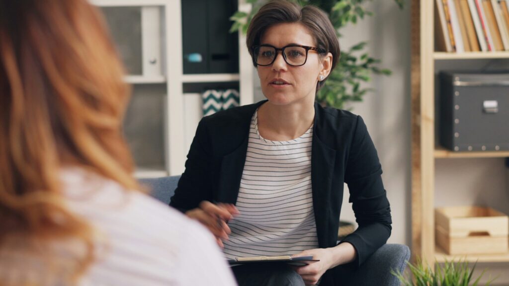 Therapist listening to a client during an individual counseling session