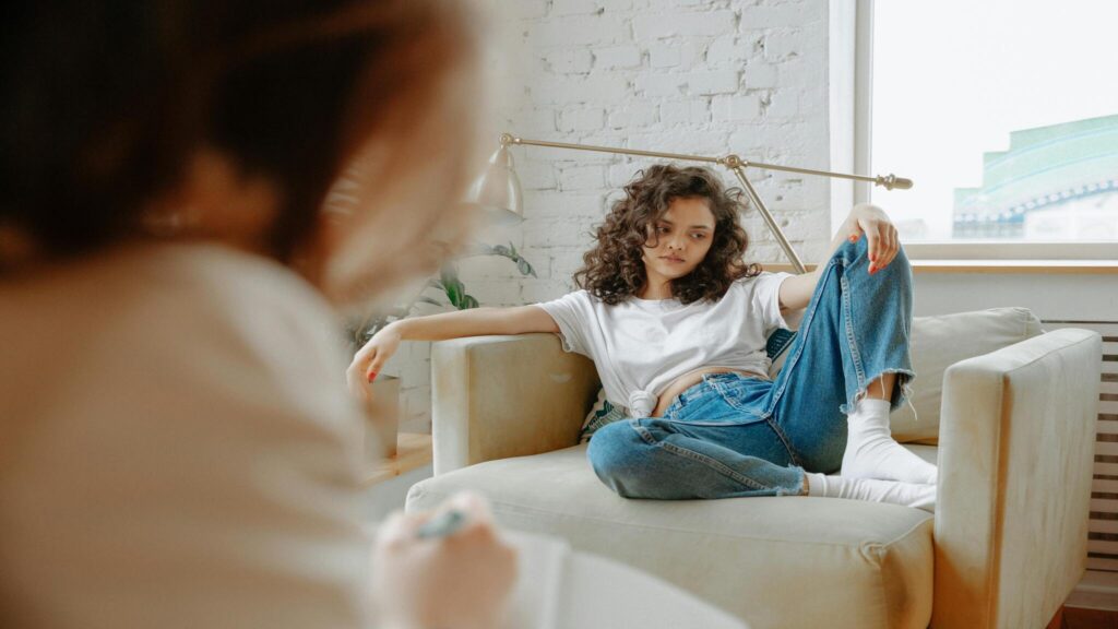 Client talking with a therapist during an individual trauma therapy session