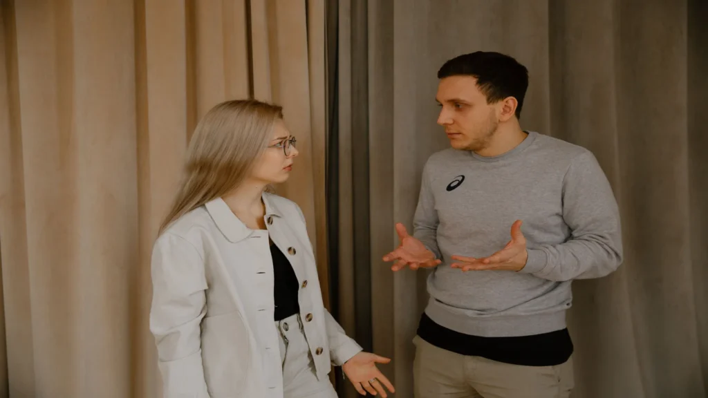 Couple having a difficult conversation while experiencing emotional distance in their relationship