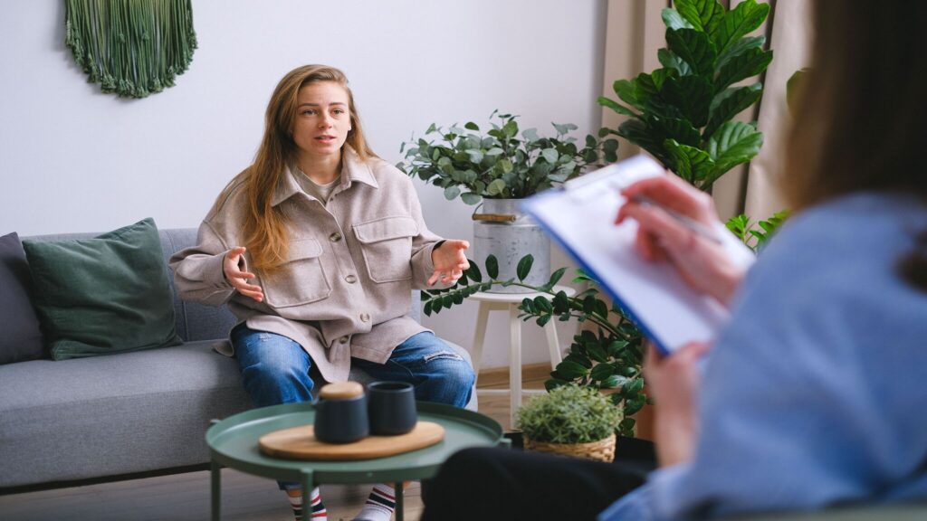 Client discussing nervous system dysregulation symptoms with a therapist