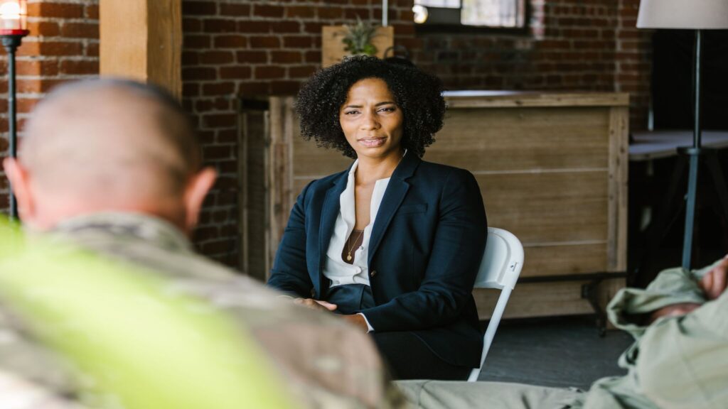 Therapist listening during a trauma therapy session focused on nervous system regulation