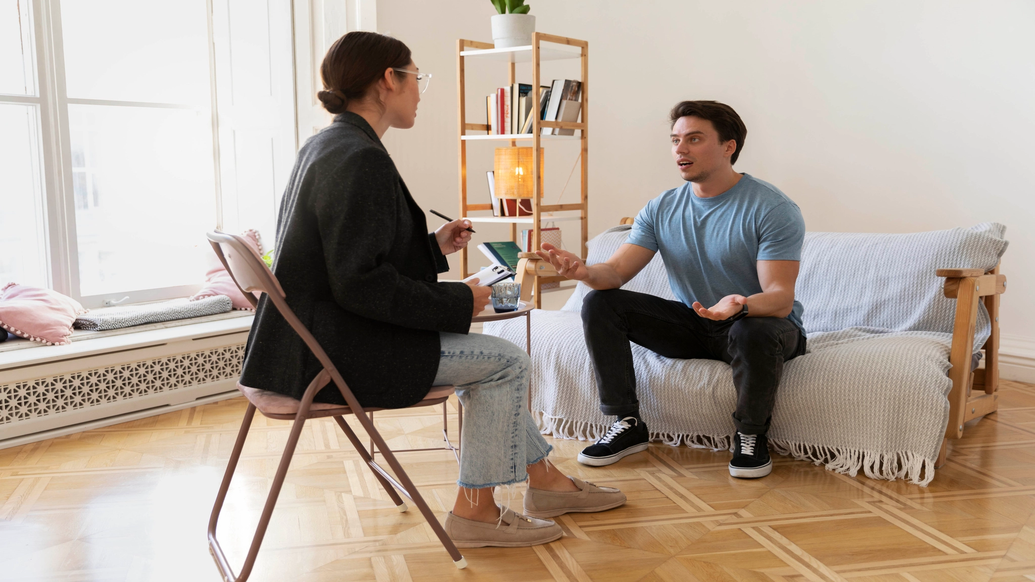 Therapist talking with a client during a counseling session